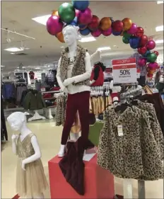  ?? D’INNOCENZIO ?? A children’s clothing display at Macy’s at Garden State Plaza on Saturday in Paramus, N.J. Parking lots were full and shopping bags were plentiful in some places Saturday as holiday gift-seekers were out looking for bargains, even as the competitio­n...