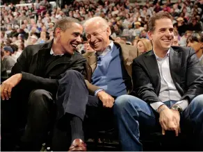  ??  ?? GAME CHANGE Obama with Joe and Hunter Biden at a college basketball game in 2010. Hunter’s troubles have haunted his father’s campaign.