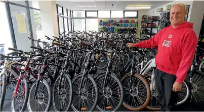  ??  ?? Wellington Electric Bikes owner Clive Randall says his e-bike sales have doubled every year.