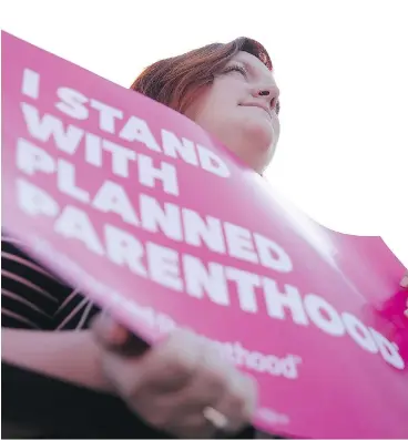  ?? ALEX WONG / GETTY IMAGES ?? Planned Parenthood supporters rally in Washington Wednesday. Canada is helping fill the internatio­nalfunding gap for sex health programs.