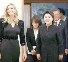  ?? — Reuters ?? South Korean President Moon Jae-In, his wife Kim Jung-Sook and Ivanka Trump arrive for their dinner at the Presidenti­al Blue House in Seoul on Friday.