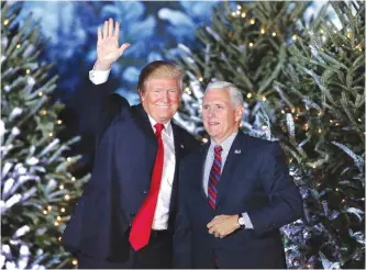  ?? — AP ?? ORLANDO: President-elect Donald Trump takes the stage with Vice President-elect Mike Pence during a rally on Friday night.