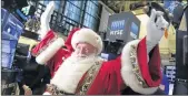  ?? RICHARD DREW / AP 2015 ?? Santa Claus visits the trading floor of the New York Stock Exchange, perhaps to set off a rally in his name.