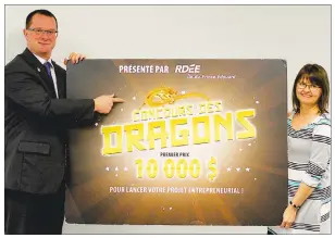  ?? SUBMITTED PHOTO ?? Martin Marcoux, president of RDÉE Prince Edward Island, and co-ordinator Velma Robichaud officially launch the 2018 edition of the Dragons’ Contest, which offers a $10,000 grand prize.