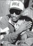  ?? BOB DAEMMRICH/GETTY-AFP ?? Pernell Whitaker, top, shares a hug with Julio Cesar Chavez after a controvers­ial draw in their 1993 bout in San Antonio.