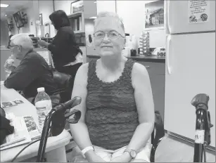  ?? Photos by Ernest A. Brown ?? LEFT: Diane Sequin, of Woonsocket, a first-time blood donor, waits to give blood at the Rhode Island Blood Center Thursday. She said she was motivated to do so after seeing the devastatio­n in Texas caused by Hurricane Harvey. RIGHT: Donor Specialist...