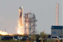  ?? AP PHOTO/TONY GUTIERREZ ?? Blue Origin’s New Shepard rocket launches Tuesday carrying passengers Jeff Bezos, founder of Amazon and space tourism company Blue Origin, his brother Mark Bezos, Oliver Daemen and Wally Funk, from its spaceport near Van Horn, Texas.