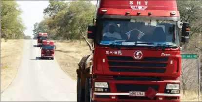  ??  ?? The country has seen an increase in the number of haulage trucks on highways.The Picture taken recently shows a convoy of Zambian trucks making its way to South Africa along the Victoria Falls-Bulawayo highway. (Picture by Eliah Saushoma)