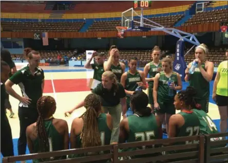  ?? PHOTOS BY TIM REYNOLDS — THE ASSOCIATED PRESS ?? This photo taken shows Siena women's coach Ali Jaques talking with her team before a game against the Cuban national team at Coliseo de la Ciudad Deportiva in Havana, Cuba. Siena played three games against the Cuban national team, plus hosted two...