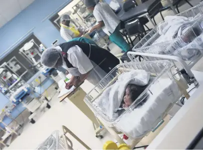  ?? Picture: Nigel Sibanda ?? BUSINESS AS USUAL. A nurse checks on a baby at Thelle Mogoerane Hospital in Vosloorus yesterday during the Human Rights Commission’s site inspection following reports of six babies dying after a klebsiella pneumonia outbreak at the hospital.