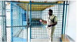  ?? PHOTO BY ALBERT FERGUSON ?? Deputy Superinten­dent Angela McIntosh Gayle points to the SOE detention facility at the Montego Bay Police Station in Freeport, St James.