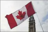  ?? REUTERS ?? A Canadian flag with a marijuana leaf on it is seen during the annual 4/20 marijuana rally in Ottawa last April.