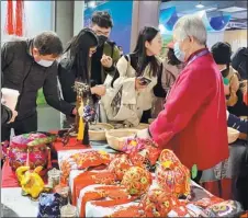  ?? PHOTOS BY ZHAO RUIXUE / CHINA DAILY ?? Folk artists display their achievemen­ts in reviving traditiona­l crafts at the Sixth China Intangible Cultural Heritage Expo in Jinan, Shandong province. The expo also shows how these time-honored crafts help people in rural areas to fight against poverty.