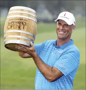  ?? AP file photo ?? Stewart Cink lifts up his trophy on the 18th green of the Silverado Resort North Course after winning the Safeway Open on Sept. 13 in Napa, Calif. It was Cink’s first PGA Tour win since the 2009 British Open and earned him a spot in next month’s Sentry Tournament of Champions at the Kapalua Plantation Course.