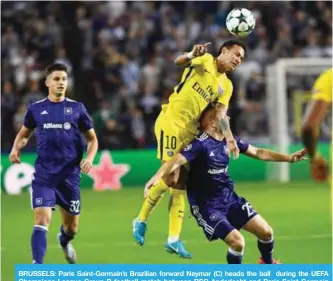  ?? —AFP ?? BRUSSELS: Paris Saint-Germain’s Brazilian forward Neymar (C) heads the ball during the UEFA Champions League Group B football match between RSC Anderlecht and Paris Saint-Germain (PSG) at the Constant Vanden Stock Stadium in Brussels.