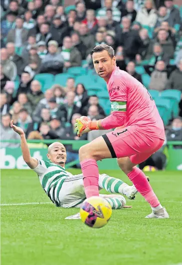  ?? ?? Forlorn Hibs keeper David Marshall watches as Daizen Maeda notches up a sixth for Celtic