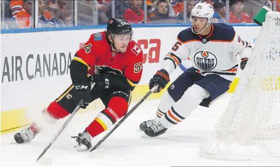  ?? JASON FRANSON/THE CANADIAN PRESS/FILES ?? Flames prospect Rasmus Andersson, chased by Edmonton Oiler Darnell Nurse in pre-season action, wants his buddy Andre Burakovsky and the Washington Capitals to “get the next one” so they can celebrate with the Stanley Cup together in Sweden this summer....