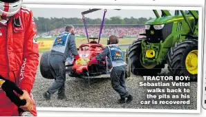  ??  ?? TRACTOR BOY: Sebastian Vettel walks back to the pits as his car is recovered