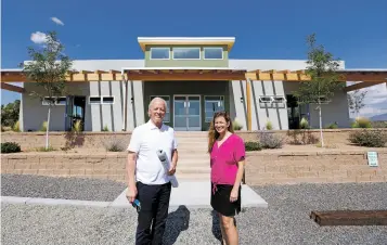  ??  ?? Geiss and Clayton stand outside Journey Montessori School’s recently constructe­d schoolhous­e Thursday. Journey Montessori School was among five Santa Fe nonprofits that benefited from a Realty Gift Fund transactio­n.