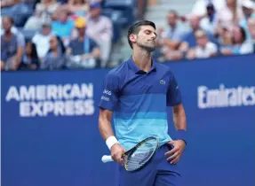  ?? DANIELLE PARHIZKARA­N/USA TODAY SPORTS ?? Novak Djokovic reacts to a missed shot against Daniil Medvedev during the U.S. Open men’s singles final Sunday.