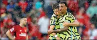  ?? PHOTO: REUTERS ?? Arsenal’s William Saliba, second right, and Gabriel, right, celebrate after beating Manchester United 1-0 at Old Trafford in Manchester, England, on Sunday.