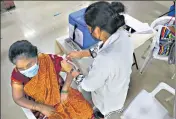  ??  ?? A health worker administer­s the Covishield vaccine during a vaccinatio­n drive in Hyderabad on Wednesday.