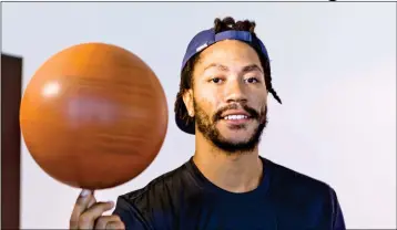  ?? ASSOCIATED PRESS ?? IN THIS FRIDAY, AUG. 25 PHOTO, CLEVELAND CAVALIERS POINT GUARD Derrick Rose poses for a photo at his agent’s Wasserman Media Group offices in Los Angeles. Rose, 28, the former MVP is coming off a fourth knee surgery, though now will be pairing with...