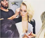  ??  ?? Before last week’s Golden Globes, Kristen Bell shared a photo on Instagram of her glam team applying makeup to her chest.