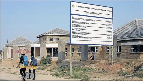  ?? PHOTO: SANDILE NDLOVU ?? Pupils walk past a newly built police station in KaMhlushwa near Malelane, Mpumalanga. In his state of the province address, premier David Mabuza said the new police station would be completed by the end of this month.