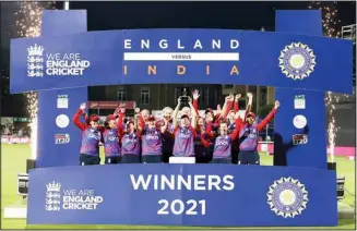  ??  ?? England’s Heather Knight lifts the series trophy with team-mates after winning the third IT20 cricket match against India at The Cloudfm County Ground, in Chelmsford, England, on July 14. (AP)