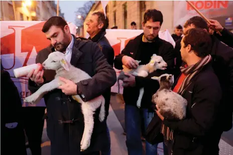  ?? AFP ?? Farmers wait to meet French prime minister Emmanuel Macron during a protest against the ‘wolf plan’ in Paris