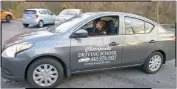  ??  ?? Huntingtow­n High School junior MacKenzie Dillon gets ready to go with driving instructor Justin Koch for the last time to complete driver’s ed requiremen­ts. Koch also teaches criminal justice at Huntingtow­n.