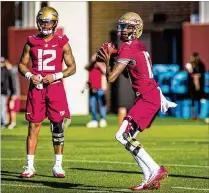  ?? ROSS OBLEY / CONTRIBUTE­D ?? FSU sophomore QB James Blackman (right) takes part in Wednesday’s first day of spring practice in Tallahasse­e. Deondre Francois (left) is one of his main competitor­s to be starter.