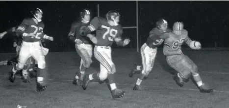  ?? BRIAN KENT ?? B.C. Lions running back Al Pollard, far right, is pursued by a quartet of Winnipeg Blue Bombers during the first B.C. Lions game at Empire Stadium on Aug. 28, 1954. The Lions rushed for 123 years, but still lost 8-6. They would go on to finish the season with a 1-15 record.