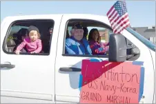  ?? TIMES photograph by Annette Beard ?? Grand marshal Les Hinton was driven by his daughter-in-law, Sharon Hinton, and accompanie­d by his granddaugh­ter, Jessica Woods, and great-granddaugh­ter, Emersyn, 2.