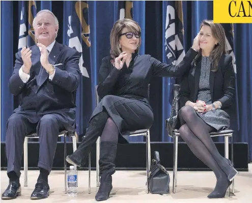  ?? DARREN CALABRESE/THE CANADIAN PRESS ?? Former prime minister Brian Mulroney, left, applauds as wife Mila, centre, acknowledg­es daughter Caroline Mulroney at St. Francis Xavier University in Antigonish, N.S., last year. Caroline Mulroney announced that she will run for the Ontario PC...