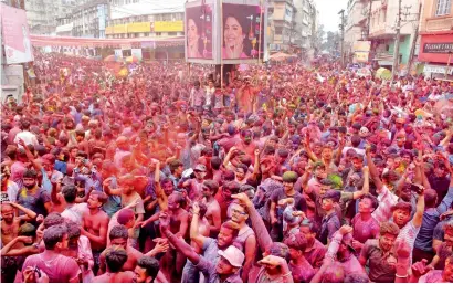  ?? AFP ?? Thousands of revellers at Fancy Bazar in Guwahati, Assam, on Friday. —