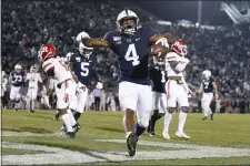  ?? BARRY REEGER — THE ASSOCIATED PRESS ?? Penn State running back Journey Brown celebrates his third-quarter touchdown run against Rutgers Saturday, one of three scores in helping the Nittany Lions shake a slow start to handle Rutgers, 26-7.