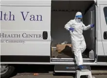  ?? Matt StONe / HeraLd StaFF FILe ?? MORE TESTS: Melissa Leaston, director of nursing at Whittier Street Health Center, gets out of her van at a COVID-19 testing site in Nubian Square in Roxbury on Thursday.