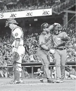  ?? ANDREW HARNIK/AP ?? The Diamondbac­ks’ Yasmany Tomas is congratula­ted by Brandon Drury, right, after hitting a three-run home run in the fourth inning Monday against the Nationals in Washington.