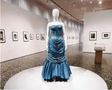  ?? Karen Warren / Staff photograph­er ?? A Charles James ballgown reflects the glamorous nature of early-20th-century fashion and fashion photograph­y.