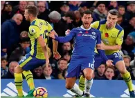  ?? AFP ?? Chelsea’s Eden Hazard is held back by Everton defender Seamus Coleman during the Premier League match. —