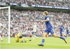  ??  ?? Chelsea’s Spanish defender Marcos Alonso celebrates scoring their second goal during the English Premier League football match between Tottenham Hotspur and Chelsea at Wembley Stadium in London, on August 20, 2017.- AFP photo