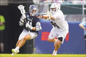 ?? Drew Hallowell / Getty Images ?? Matt Brandau was one of three Yale men’s lacrosse players with two goals in win over No. 1 Penn State.