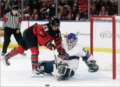  ?? The Canadian Press ?? United States goaltender Nicole Hensley stops Canada’s Marie-Philip Poulin on a penalty shot during overtime Rivalry Series hockey action in Kelowna, Nov. 15.