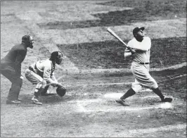  ?? ASSOCIATED PRESS ?? NEW YORK YANKEES’ BABE RUTH hits a home run. As part of its collection of Babe Ruth items, the Baseball Hall of Fame says it has the bat the slugger used to hit his then-record 60th home run in 1927.