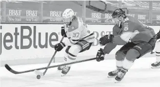  ?? LYNNE SLADKY/AP ?? Stars center Justin Dowling (37) skates with the puck as Panthers center Aleksander Barkov (16) pursues during the second period Thursday in Sunrise.