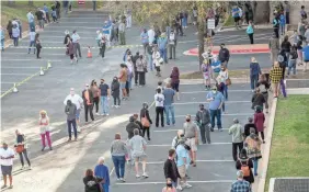  ?? JAY JANNER/AUSTIN AMERICAN-STATESMAN VIA AP ?? Early voters line up in Austin, Texas.