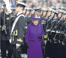  ?? Picture: PA. ?? The Queen is escorted by HMS Queen Elizabeth’s captain, Commodore Jerry Kyd, as she inspects the ship’s company.