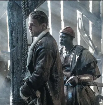  ?? WARNER BROS. ?? Charlie Hunnam, left, and Djimon Hounsou star in King Arthur: Legend of the Sword.